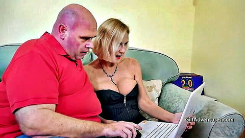 Busty thin blonde mature with fat bald man on laptop