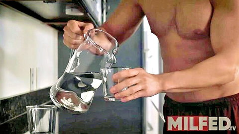 Muscular stepson pouring water in kitchen, MILFED seduction scene with Reagan Foxx