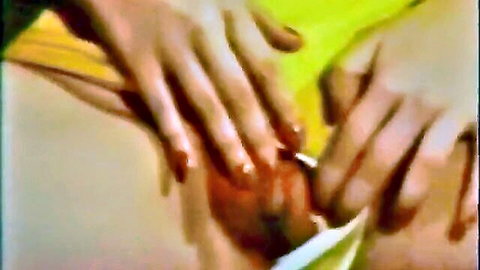 Red-nailed fingers spreading and fingering wet shaved pussy closeup