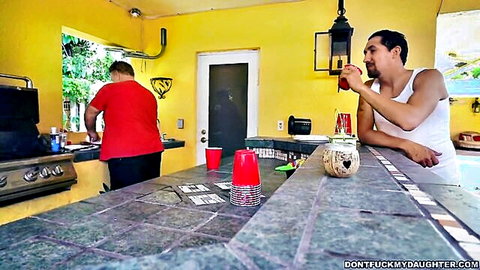 Hispanic DILF in tank top drinks at outdoor bar while friend grills in stepdad porn teaser