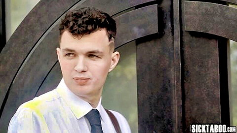 Curly-haired young man smirking in stained white shirt and tie by wooden archway