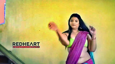 Indian cute big-bosomed cutie dancing seductively in purple saree