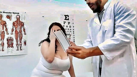 Chubby busty woman with huge tits gets eye exam from black doctor in clinic