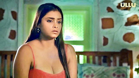 Desi Indian babe in sexy red tank top showing deep cleavage