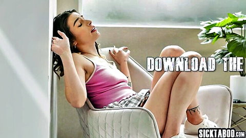 Chanel Camryn lounging seductively in pink tank top and plaid skirt