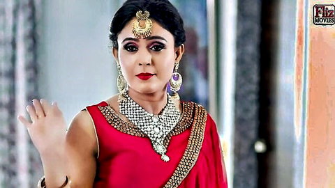 Dark-haired Indian beauty in red saree and gold jewelry, erotic Hindi short film thumbnail