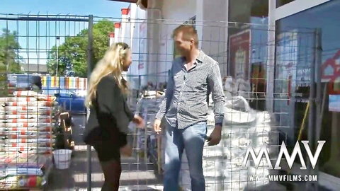 Blonde German MILF with huge tits in tight dress outdoors with handsome guy