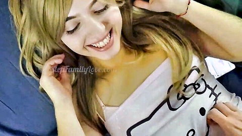 Blonde teen stepdaughter tickled by stepdad in selfie, smiling in Hello Kitty top