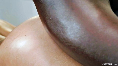 Interracial massage with blonde bombshell's curves touched by black arm