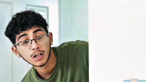 Diego Perez with curly hair and glasses in green shirt from POV stepmom scene with Anya Olsen
