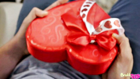 Elsa Jean holds red Valentine's heart box in stepbro tease