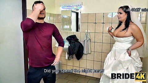 Sofia Lee as busty bride in wedding dress with man in bathroom pre-wedding