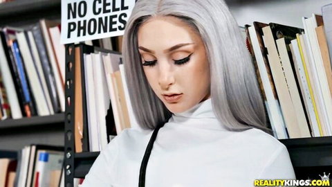Skylar Vox seductive pose in library, silver hair beauty