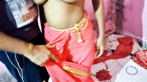 Indian Desi babe with massive tits in red sari gets touched intimately