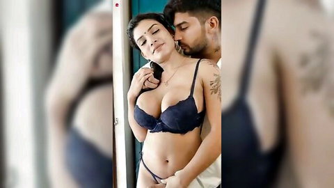 Curvy Hindi hottie in black lingerie embraces tattooed man in steamy pose
