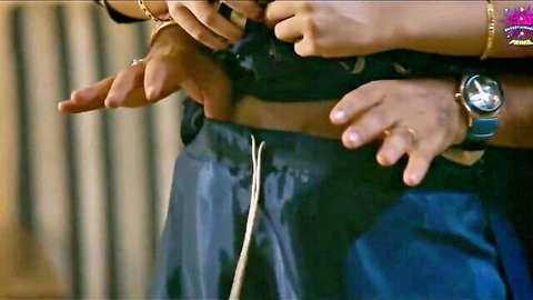 Indian brunette in bangles adjusting man's pants in steamy Hindi scene