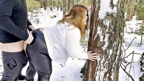 Chubby blonde babe fucked outdoors by BF through ripped leather leggings in snowy forest