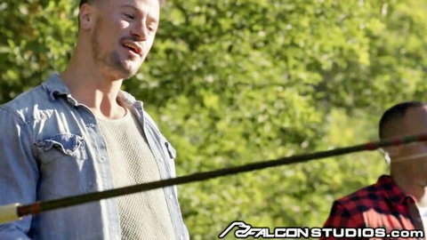 Interracial hung studs in casual outdoor setup for hot threesome action