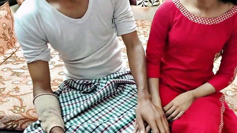 Desi girl in red dress holds hands with bandaged uncle in white shirt