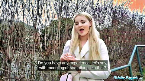Eliza Eves hot blonde smiling in public outdoor scene