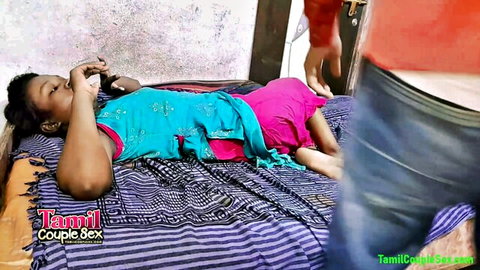 Hot Desi Indian college girl in blue top and pink skirt on bed with man
