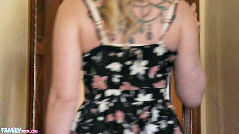 Sydney Paige in floral dress, blonde MILF showing tattooed back