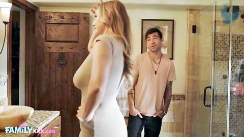 Blonde curvy stepmom in tight white dress teases man in bathroom