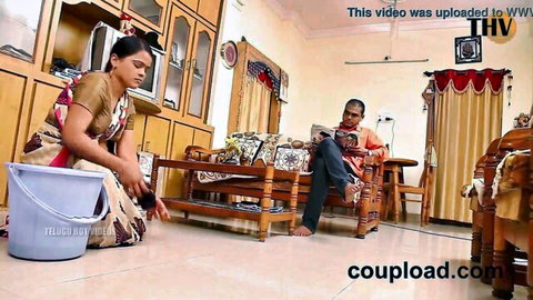 Indian maid in saree cleaning floor, man watches in desi home romance
