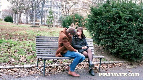 Silvia Soprano brunette in skirt and stockings sharing intimate moment on park bench