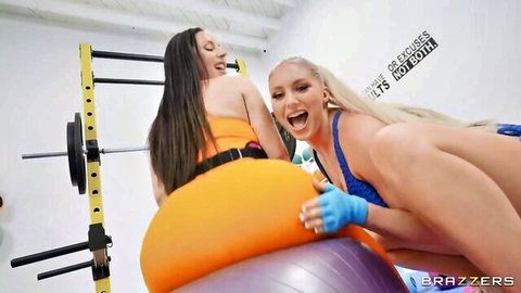 Blonde grabs curvy brunette's big ass bent over orange gym ball in teasing gym scene
