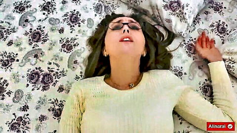 Alina Rai in ecstasy on bed, glasses on, open mouth, stepmom fantasy tease