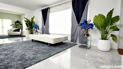 Luxurious modern bedroom interior with white bench blue flowers and plants for hot teen babe solo
