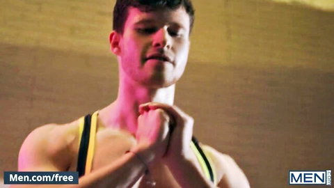 Michael Boston in muscular tank top, watching intense class scene