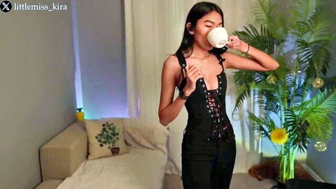 Littlemiss Kira in sexy black dress, sipping tea seductively on hot date