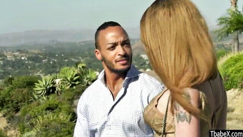 Blonde TS Angelina close with BBC guy outdoors, teasing cleavage