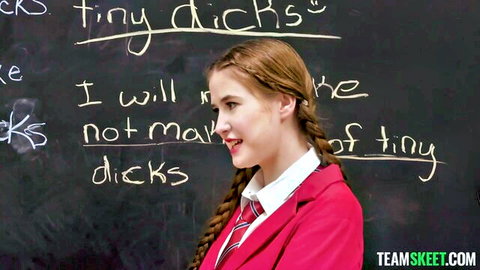 Gracie Gates in schoolgirl uniform writing anti-tiny dick pledge on blackboard