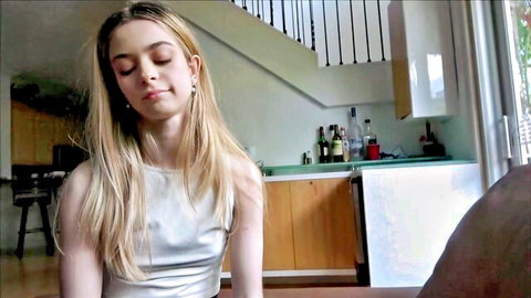 Blonde teen Molly Little in pensive pose, casual home vibe