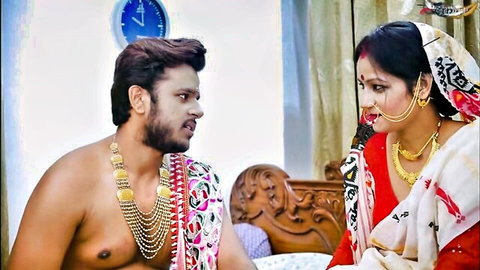 Desi wedding night couple in saree and jewelry, intimate gaze