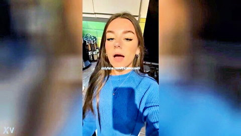 Young brunette in blue sweater with surprised face, accidental solo fingering tease