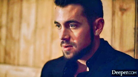 Handsome bearded man with blue eyes in dark shirt, intense gaze for adult video