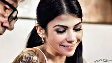 Tanned young brunette babe with pigtails and rose tattoo smiles seductively at older man in taboo old young scene