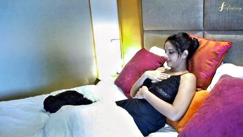 Seductive Indian stepmom in black lace lingerie teasing on bed with big nipples