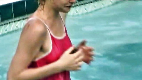 Skinny wet teen babe in red tank top squeezing her tits in pool