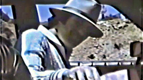 Vintage fellatio scene: suited man in hat receives oral action