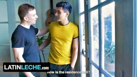 Two handsome Latino guys in t-shirts chatting intimately near a door in gay LatinLeche scene