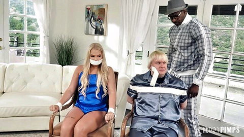 Bound blonde in lingerie gagged with older man and suited black guy in bondage tease
