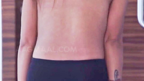 Steamy back view of topless Indian hottie in black pants, erotic tease