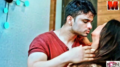 Indian MILF passionately kissing muscular lover in red shirt