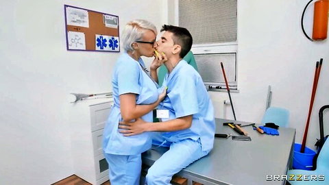 Blonde nurse in glasses passionately kissing male doctor in hospital room
