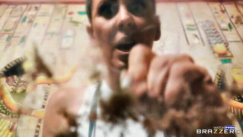 Shocked man with wide open mouth reacts to facial splash from hand in Brazzers scene